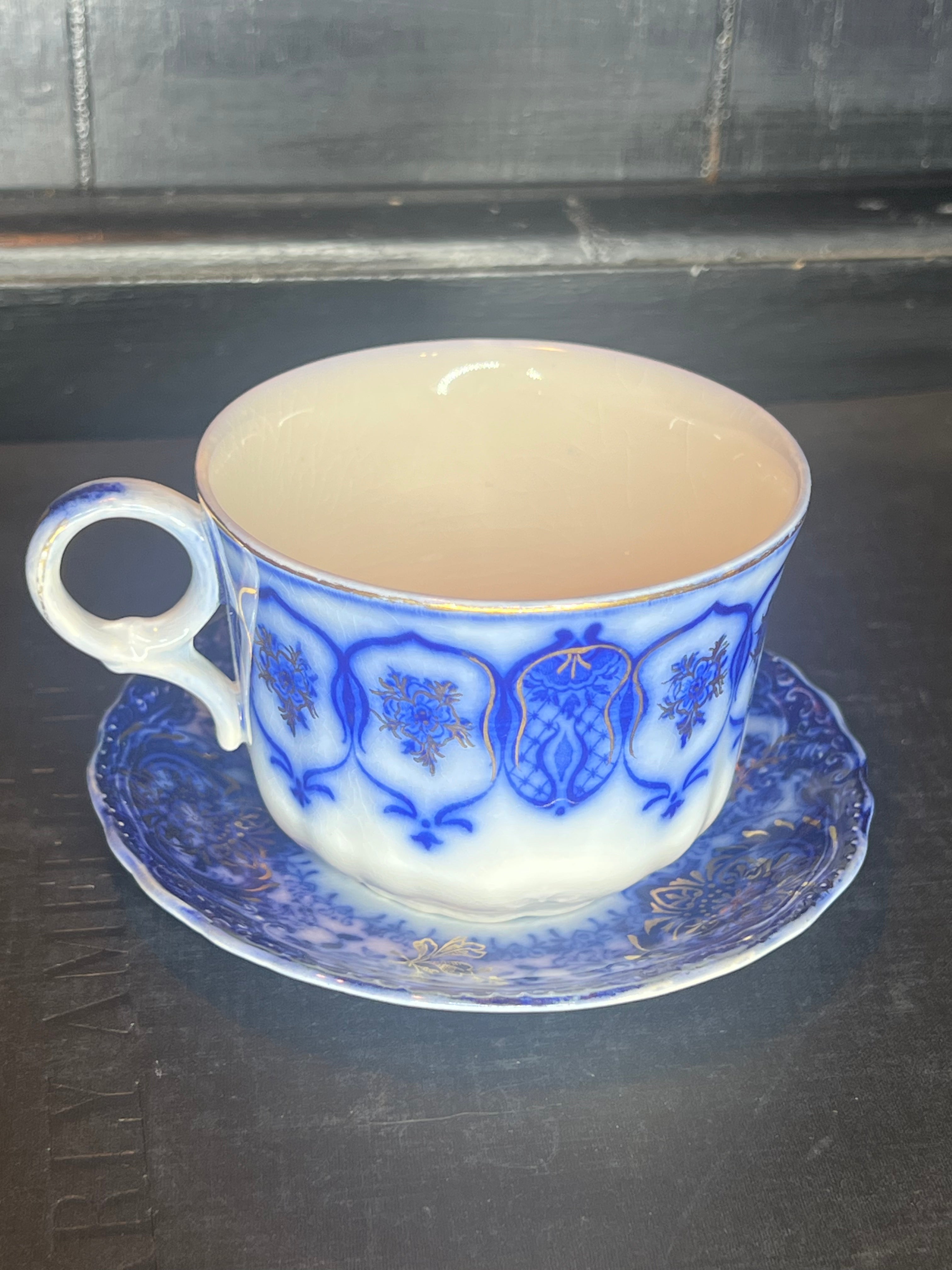 Antique Flow Blue Teacup and Saucer
