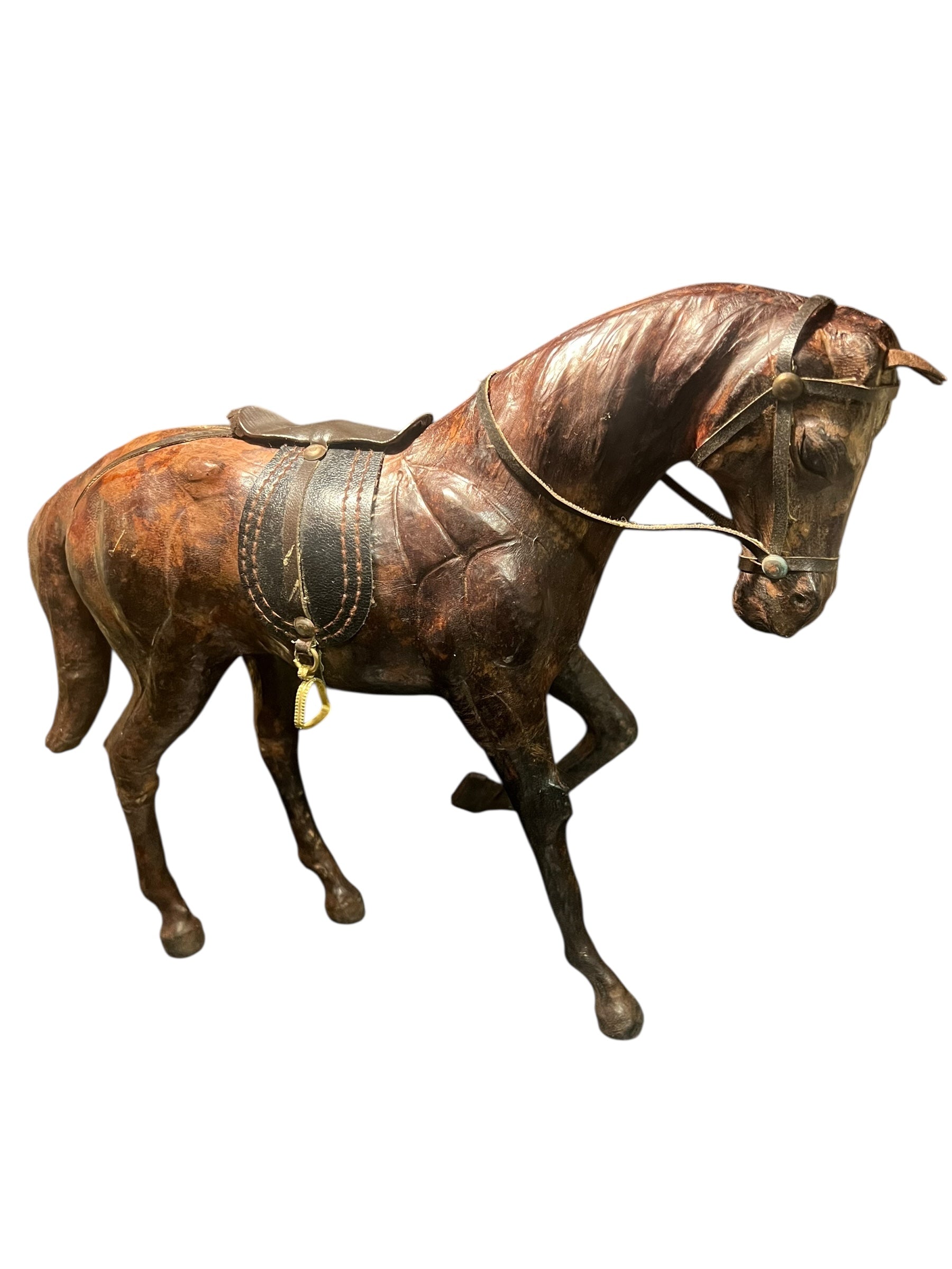 Vintage leather wrapped horse standing