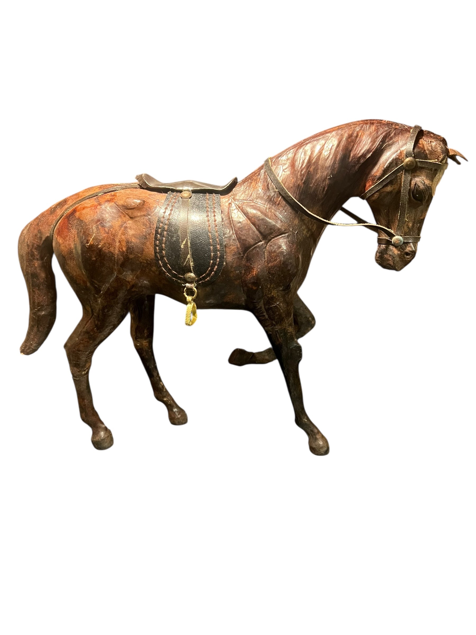 Vintage leather wrapped horse standing